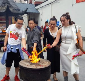 Worshipers lighting incense at Jade Temple Shanghai